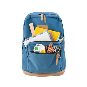 Blue school backpack with various supplies isolated on white background