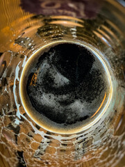 A Beer glass with top view half filled