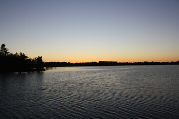 Naklejka premium sunset over the river