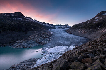 dramatic colored clouds at sunset over Rhoneglacier