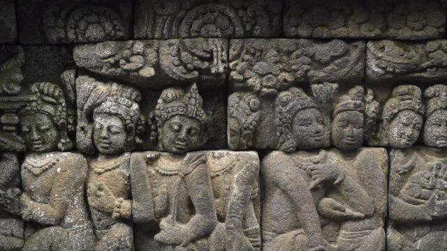 Candi Borobudur - Mahayana Javanese Buddhist Temple UNESCO World Heritage Site - Beautiful Buddha Reliefs in Yogyakarta Magelang, Central Java, Indonesia Indonesians