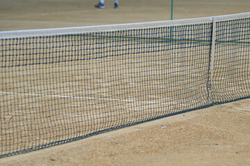 Tennis net and sand tennis court