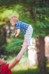 father and son having fun in the park
