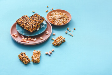 Crispy rice bars on color background
