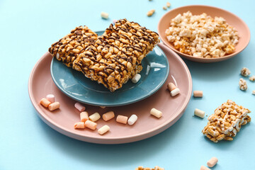 Crispy rice bars on color background