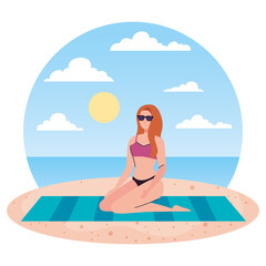 woman with swimsuit sitting on the towel, in the beach, holiday vacation season