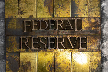 Federal Reserve text formed with real authentic typeset letters on vintage textured silver grunge...