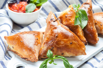 Delicious samosa on a tablecloth background