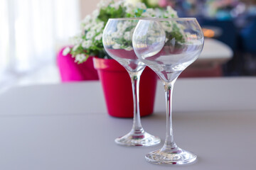 Two wine glasses on table, close up