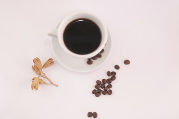 coffee in white cup seen from above with beans