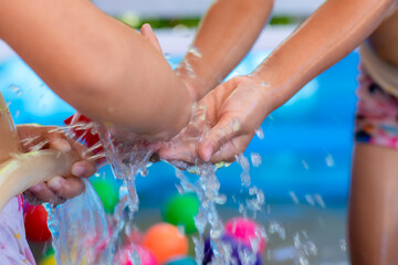 3-4 year-old girls, ASEAN people playing in the inflatable pool