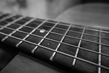 Fototapeta premium Acoustic guitar, black and white photo, musical instrument and strings.