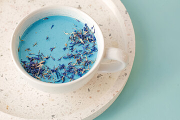 Blue moonmilk healthy drink in a white cup