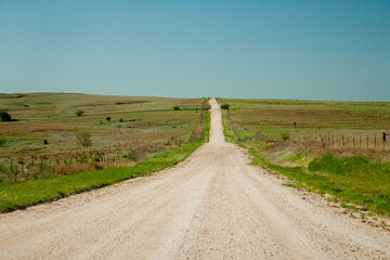 A gravel road through range land in the Oklahoma panhandle.