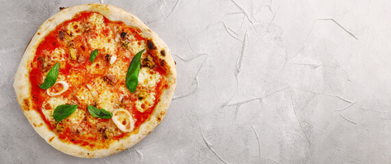 pizza with seafood banner top view on light concrete or stone table top view. pizza with squid and mussels closeup