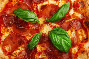 pizzaa pepperoni background. pizza with meat and basil top view