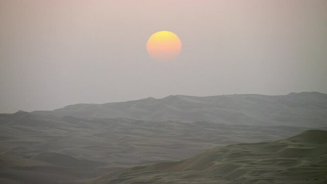 A rare picture-perfect sunset of the Arabian desert as it zooms out of the horizon  6-axis stabilized gimbal, Shotover F1, 8K, parallax.