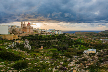 Naklejka premium Mellieha Surrounded by a bed of clouds