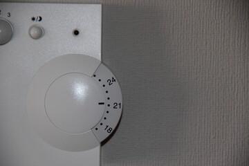 White controller air-conditioning in the room on the gray wall