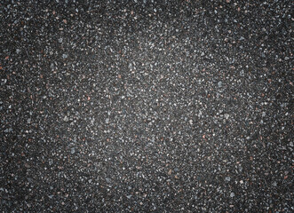 Asphalt road texture, top view. Dark grey abstract background.