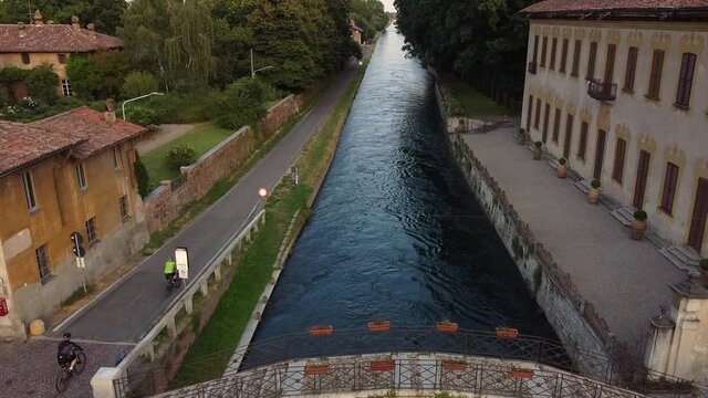 Europe, Italy , July 2020 - Drone aerial view of Robecco sul Naviglio: a little countryside village near Milan famous for Leonardo's locks - bridge and Navigli canals waterway in Ticino natural park