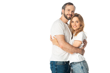 happy adult couple in white t-shirts embracing isolated on white