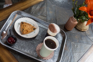 Coffee and Scones on a silver tray.