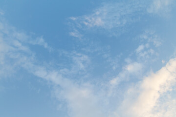 White clouds on blue sky background summer day wallpaper or banner.