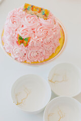 Pink Birthday cake decorated with pink flowers