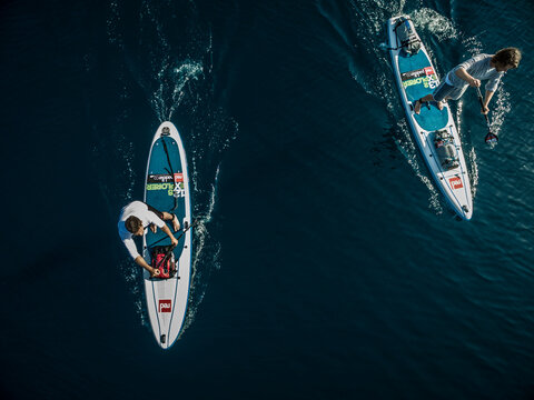 Aerial Shot Of Two People On Paddleboards.