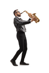 Fototapeta na wymiar Full length profile shot of a musician playing a saxophone and wearing sunglasses