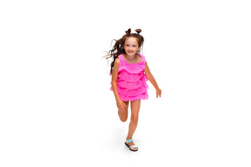Happy child, little and emotional caucasian girl jumping and running isolated on white background. Looks happy, cheerful, sincere. Copyspace for ad. Childhood, education, happiness concept.