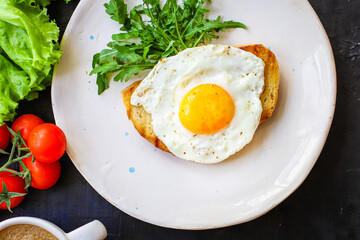 fried egg and toast bread salad delicious breakfast snack yolk and protein food background top view copy space eating healthy raw Takeaway