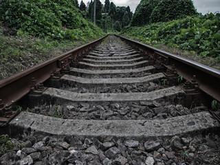 Old rails in the landscape with railroad railway leading lines 