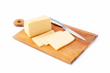 on a white background. No isolation. A small piece of cheese is cut into wedges. And a kitchen knife Close-up.