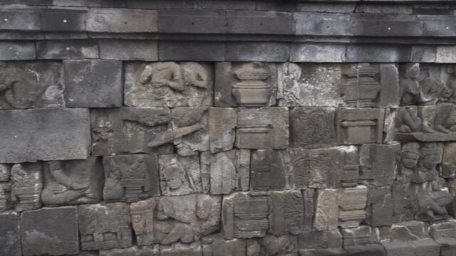 Candi Borobudur - Mahayana Javanese Buddhist Temple UNESCO World Heritage Site - Beautiful Buddha Reliefs in Yogyakarta Magelang, Central Java, Indonesia Indonesians