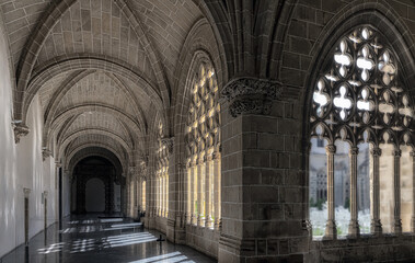 View of somber corridor in cloisters of Santa Clara convent in Jerez de la Frontera, Spain.