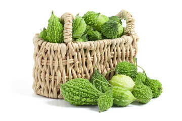Fresh Bitter melon or bitter gourd in basket isolated on white background with clipping path.