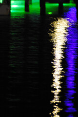 ABSTRACT- Night Lights Reflected on a Dark Sea
