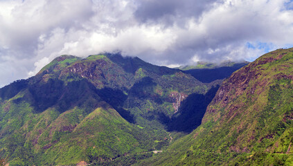 Vietnamese mountain in sunlight under cloudy sky. Sapa Vietnam.
