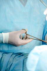 surgeon with surgical instruments