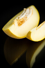 Studio shot of notched ripe melon galia with slice