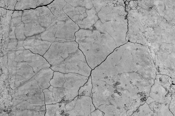 The surface of old gray cracked concrete. Close-up.
