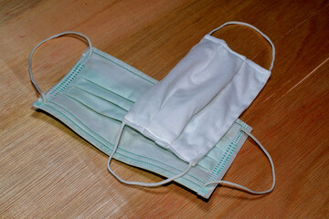 Doctor mask on wood, dark brown background for designing and copying text