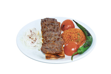 Turkish grilled meatballs on the plate with vegetables. Turkish traditional foods. 