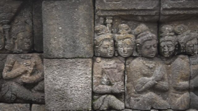 Candi Borobudur - Mahayana Javanese Buddhist Temple UNESCO World Heritage Site - Beautiful Buddha Reliefs in Yogyakarta Magelang, Central Java, Indonesia Indonesians