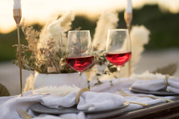 beautifully decorated table with glasses, plates, forks