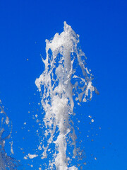 Water jet in blue sky