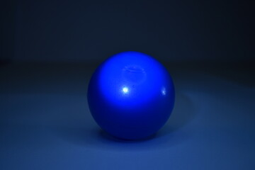 bright blue ball exposed to different lights