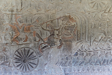 Fototapeta na wymiar The temple complex of Angkor Watt, Cambodia wall relief depicting ancient wars